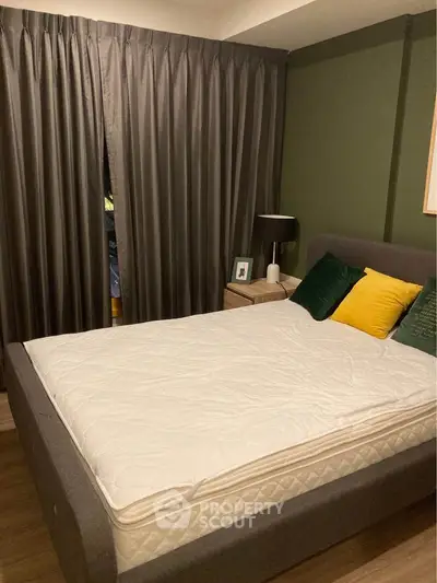 Cozy bedroom with modern decor and plush bedding in stylish apartment