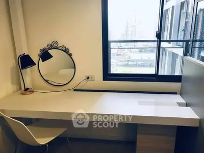 Modern study area with sleek desk and city view window