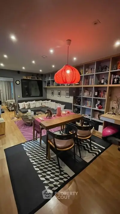 Stylish living room with modern decor, cozy seating, and ambient lighting, perfect for relaxation and entertainment.