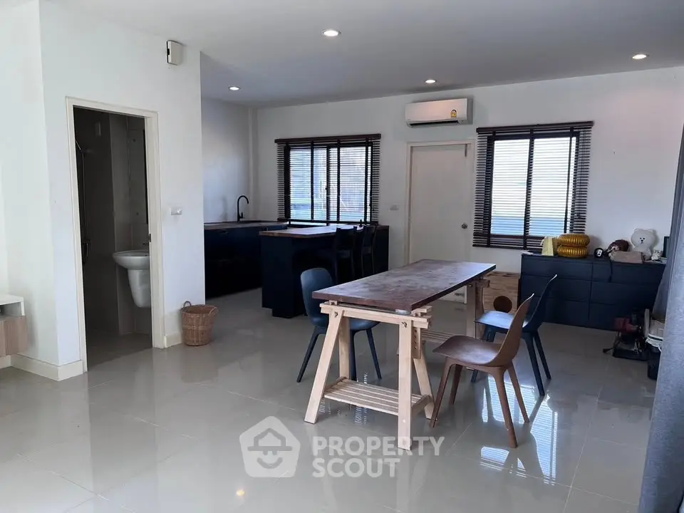 Spacious modern living room with open kitchen and stylish furniture