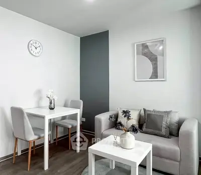 Modern living room with stylish decor and cozy seating area, perfect for relaxation and entertaining.