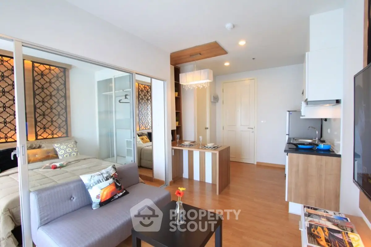 Modern studio apartment with open layout, stylish decor, and cozy living area.