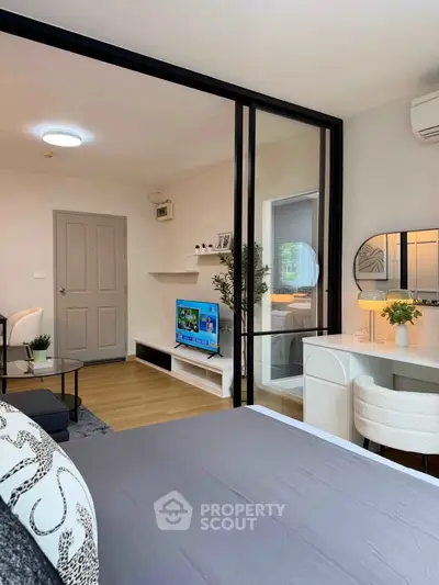 Modern bedroom with glass partition and cozy workspace