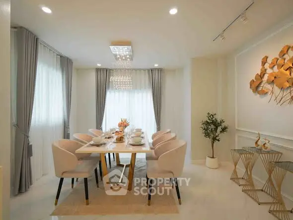 Elegant dining room with modern decor and stylish lighting in a luxurious home.