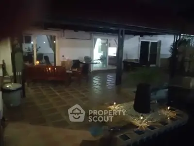 Charming patio with cozy seating and ambient lighting for relaxing evenings.