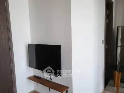 Modern apartment interior with wall-mounted TV and sleek design