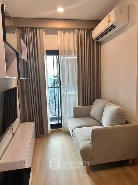 Cozy living room with modern decor and city view from balcony