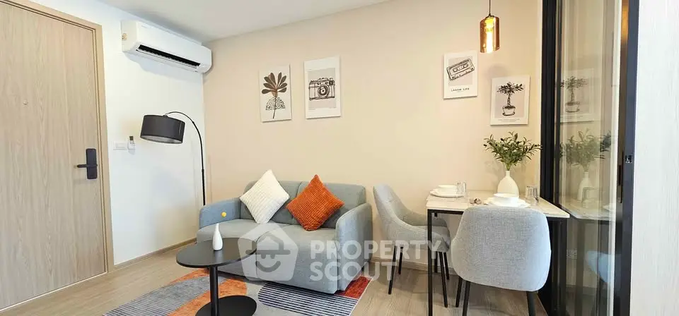 Modern living room with stylish decor and cozy seating area, perfect for relaxation and entertaining.
