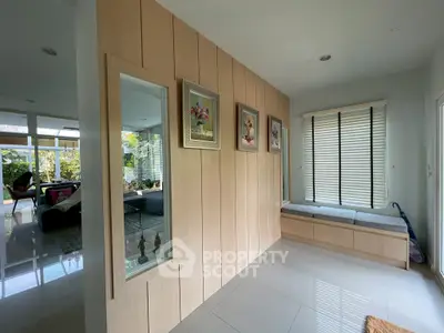 Modern living room with stylish decor and large windows offering natural light