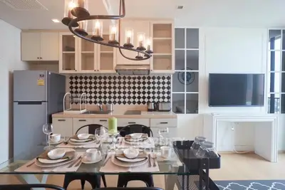 Modern kitchen and dining area with stylish decor and appliances