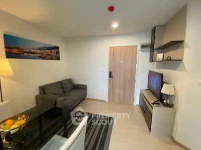 Modern living room with sleek furniture and wall art in cozy apartment