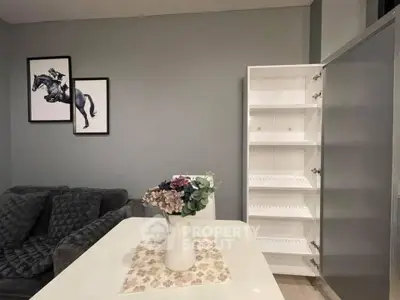 Stylish living room with modern decor and open shelving unit