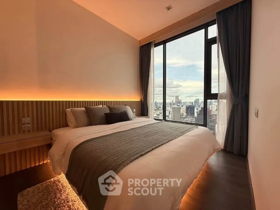 Luxurious bedroom with stunning city view and modern decor