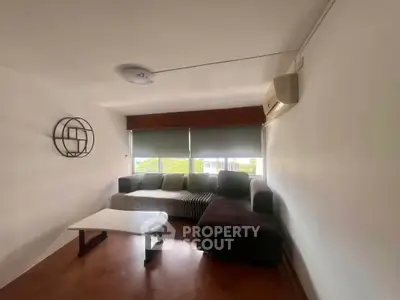 Cozy living room with modern sectional sofa and natural light