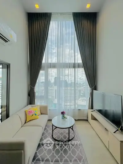 Luxurious high-ceiling living room with stunning city view and modern decor