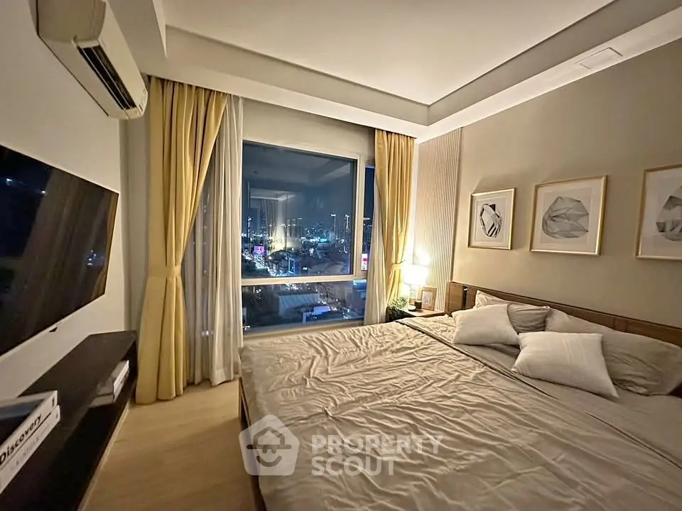 Luxurious bedroom with city view, modern decor, and ambient lighting.