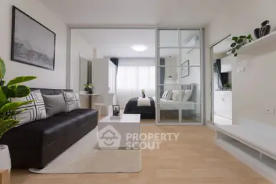 Modern studio apartment with sleek design and cozy bedroom area.