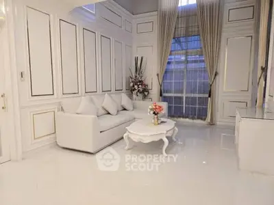 Elegant living room with high ceilings and luxurious decor