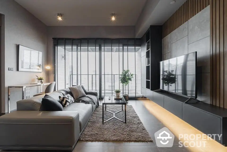 Luxurious modern living room with sleek design, large windows, and stylish furniture, perfect for upscale urban living.