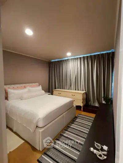 Cozy bedroom with elegant decor and ample natural light