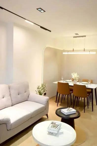 Modern living room with cozy sofa and elegant dining area