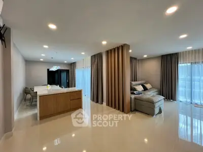 Spacious modern living room with open kitchen and elegant decor