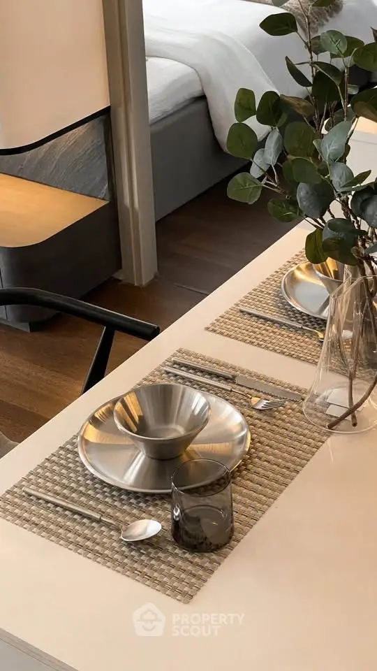 Elegant dining setup with modern tableware in a stylish apartment interior.