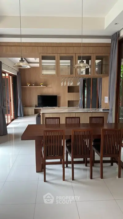 Spacious modern living room with elegant dining area and stylish wooden furniture.
