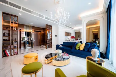 Luxurious living room with elegant decor, plush seating, and modern lighting in a sophisticated apartment.