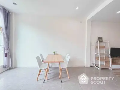 Modern dining area with minimalist decor and natural light