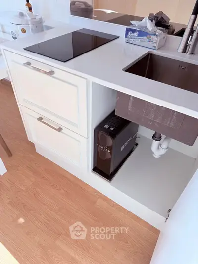 Modern kitchen with sleek cabinetry and built-in appliances