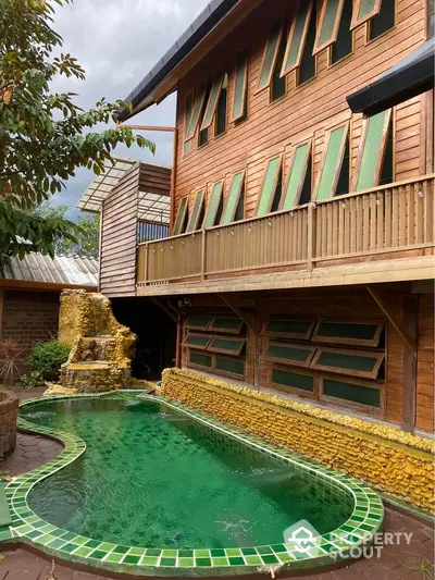 Charming wooden house with unique green-tiled pool and rustic design