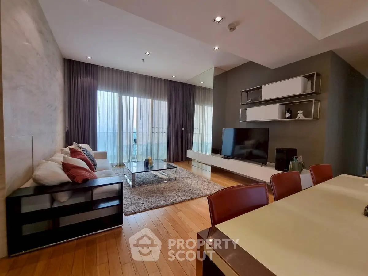 Spacious modern living room with large TV and elegant decor