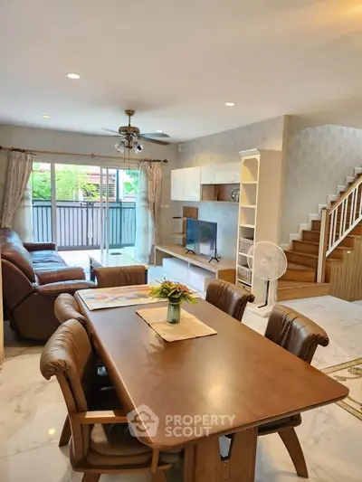 Spacious living room with elegant dining area and modern decor