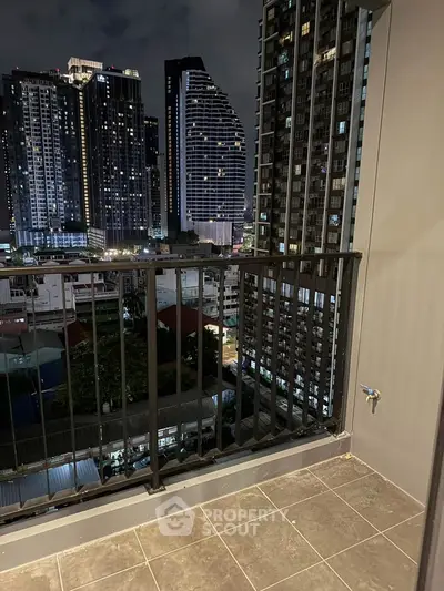 Stunning cityscape view from a modern balcony at night, perfect for urban living enthusiasts.