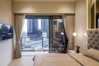 Luxurious bedroom with balcony view in modern high-rise apartment