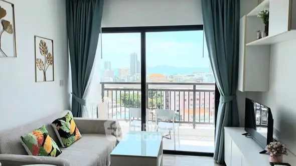 Modern living room with balcony view in high-rise apartment