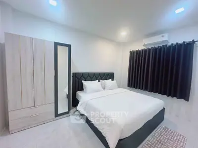 Modern bedroom with stylish bed and wardrobe, featuring elegant decor and ambient lighting.