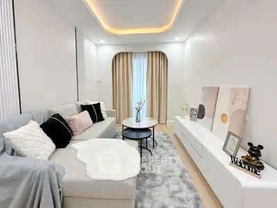 Modern living room with cozy decor and stylish furniture