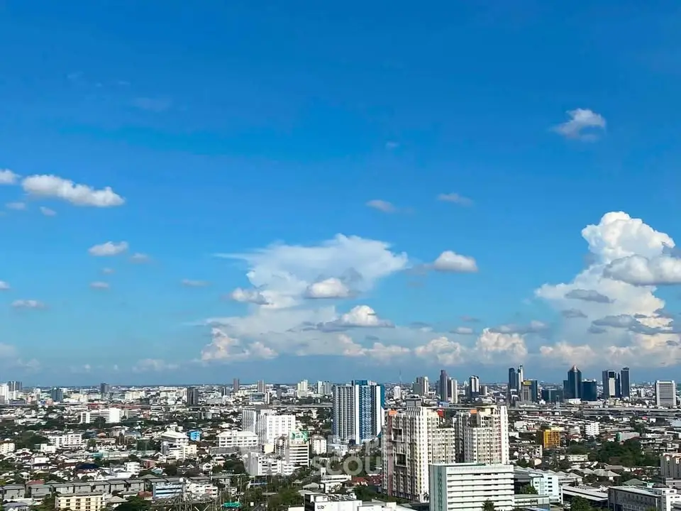 Stunning cityscape view showcasing a vibrant skyline under a clear blue sky.