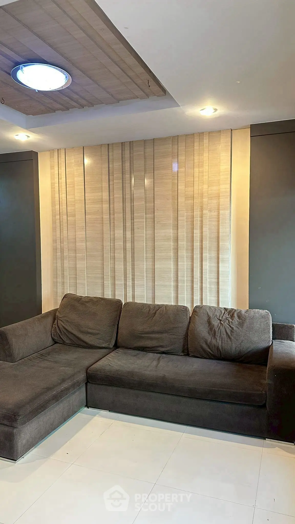 Modern living room with stylish sectional sofa and elegant lighting