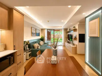 Spacious modern living room with open layout and stylish decor, featuring a cozy seating area and dining space.