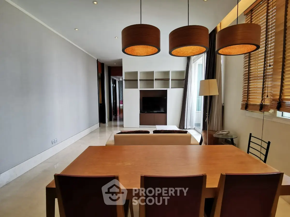 Spacious modern living room with dining area and stylish lighting