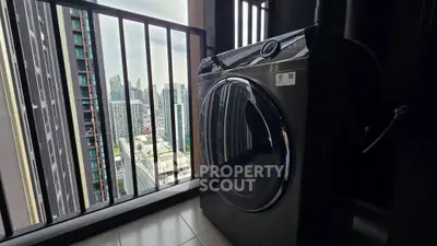 Modern high-rise balcony with city view and sleek washing machine.