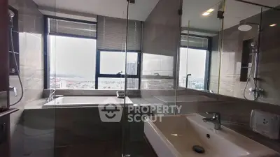 Luxurious bathroom with panoramic city view and modern fixtures