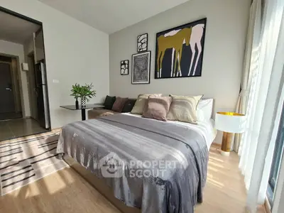 Modern bedroom with stylish decor and natural light in a contemporary apartment.