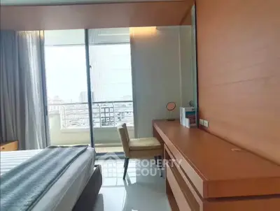 Modern bedroom with balcony view and stylish wooden furniture