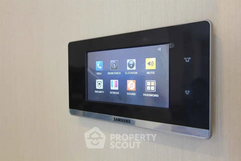 Modern smart home control panel with touchscreen interface in luxury apartment.