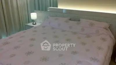 Cozy bedroom with elegant lighting and stylish bedding