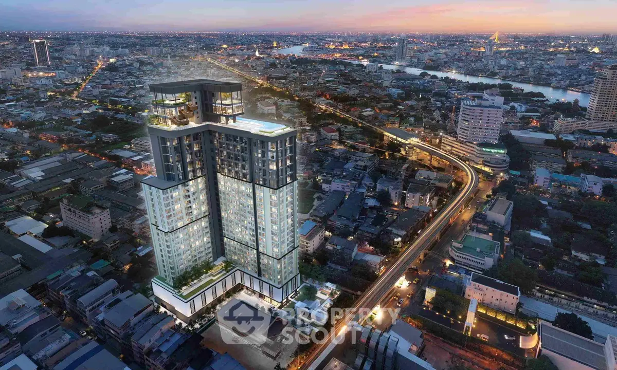 Stunning aerial view of modern high-rise building in vibrant cityscape at dusk.